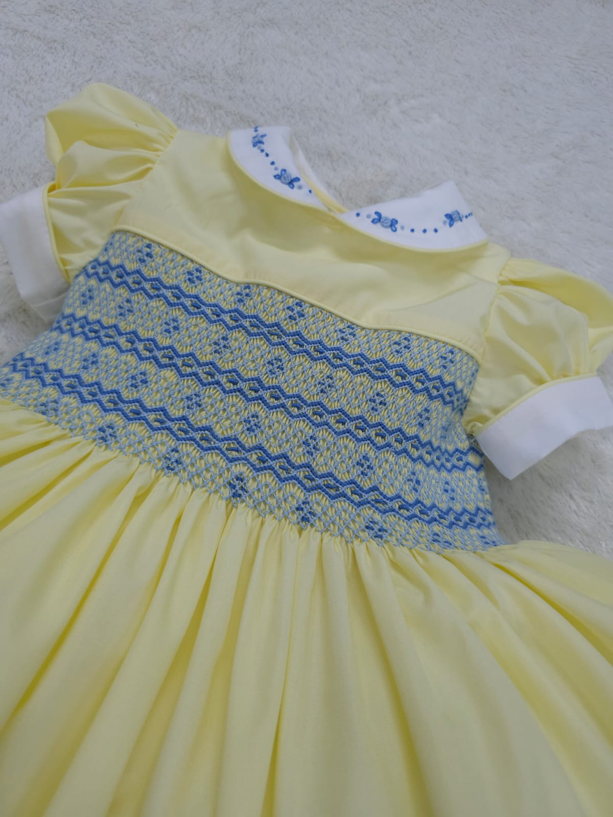 Lemon with blue smocked back and front with fixed bow. ( have matching boys suit available )