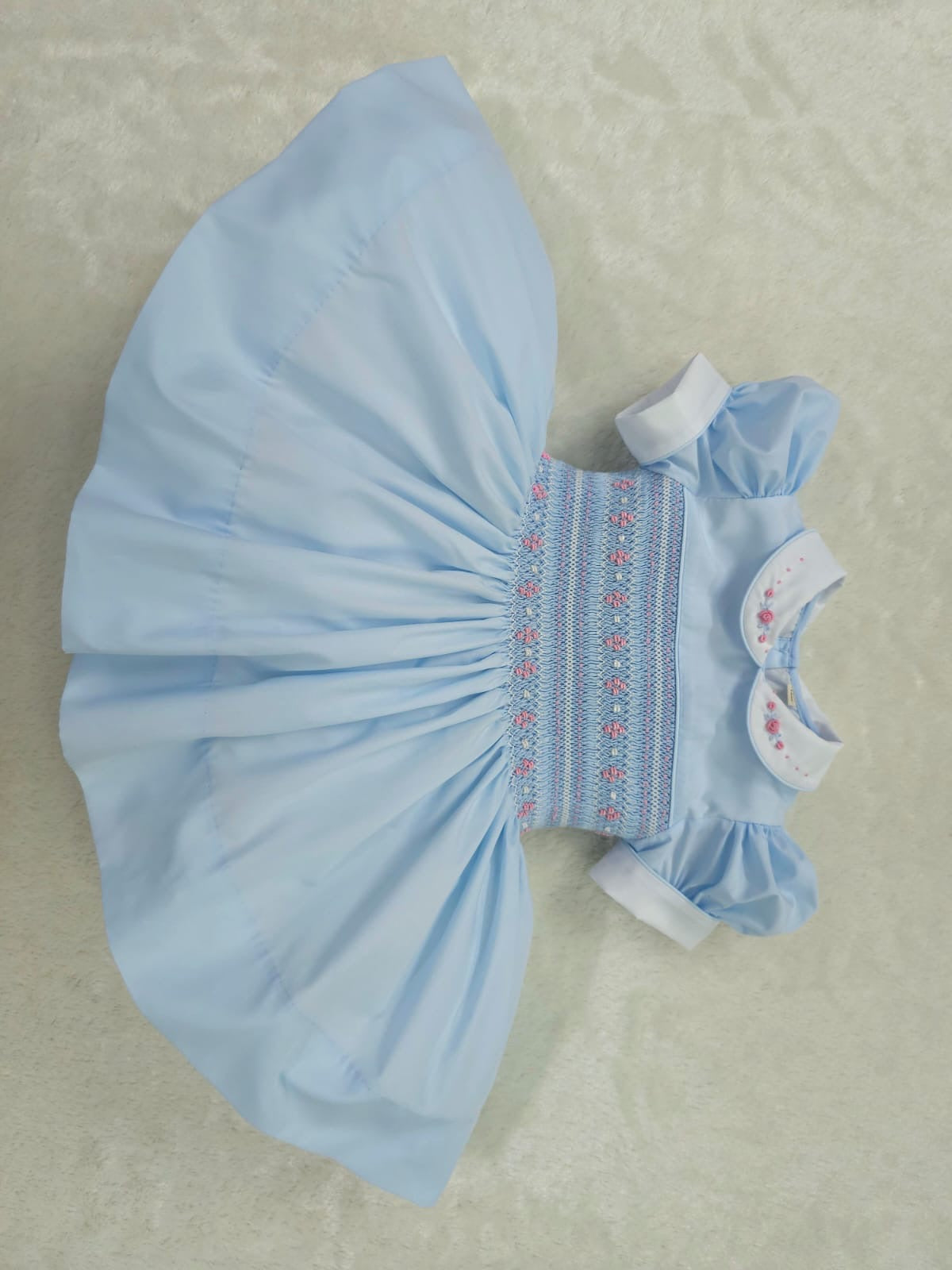 Baby blue smocked back and front