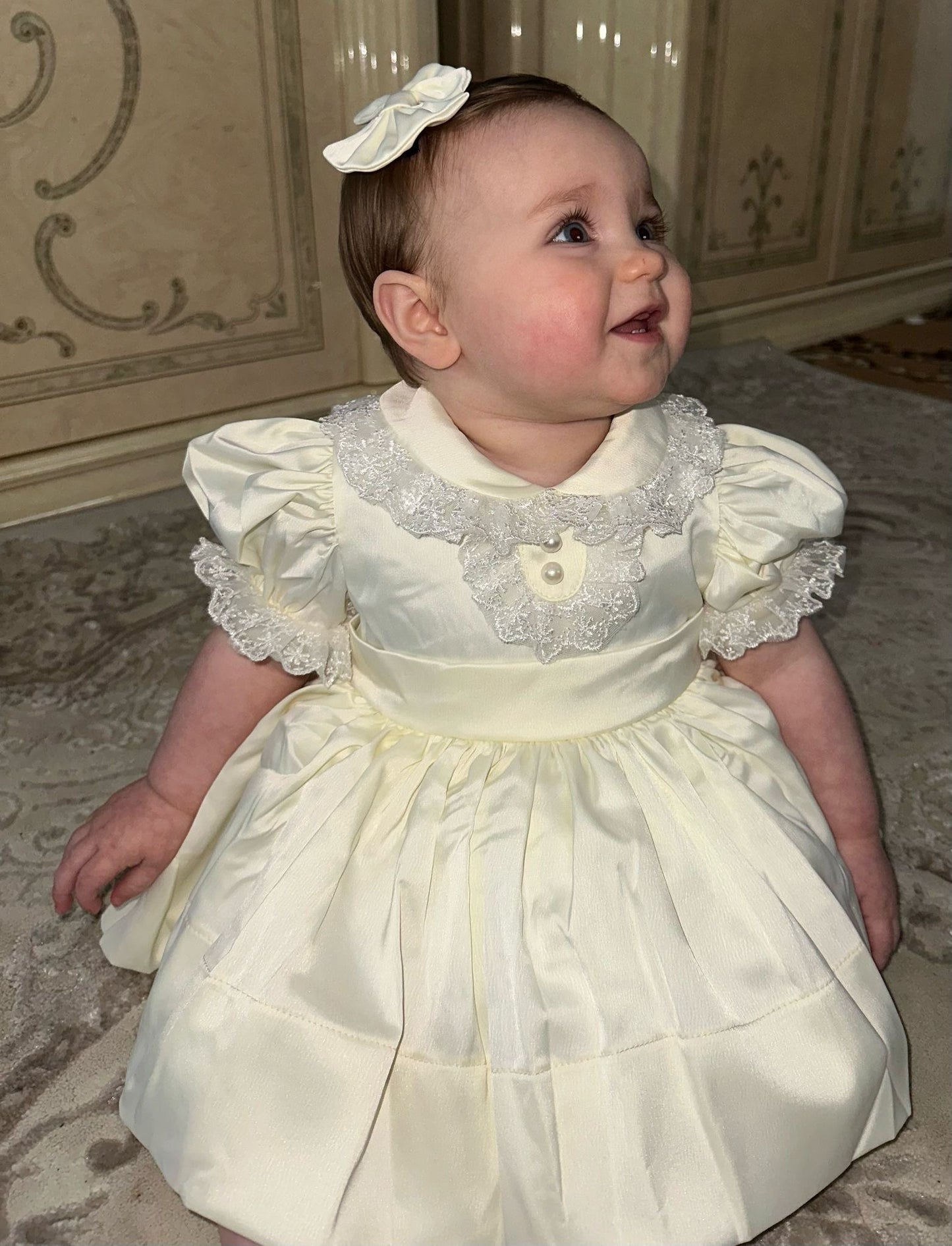 Cream classic dress with lace collar and sleeves and pearl buttons
