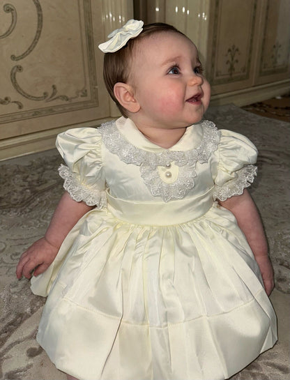 Cream classic dress with lace collar and sleeves and pearl buttons
