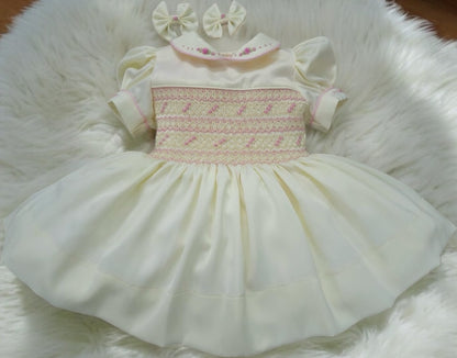 Butter cream and pink smocked dress