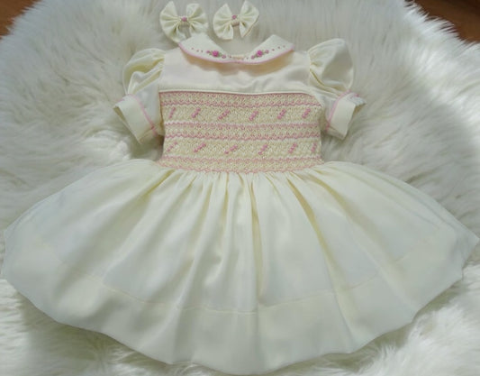 Butter cream and pink smocked dress