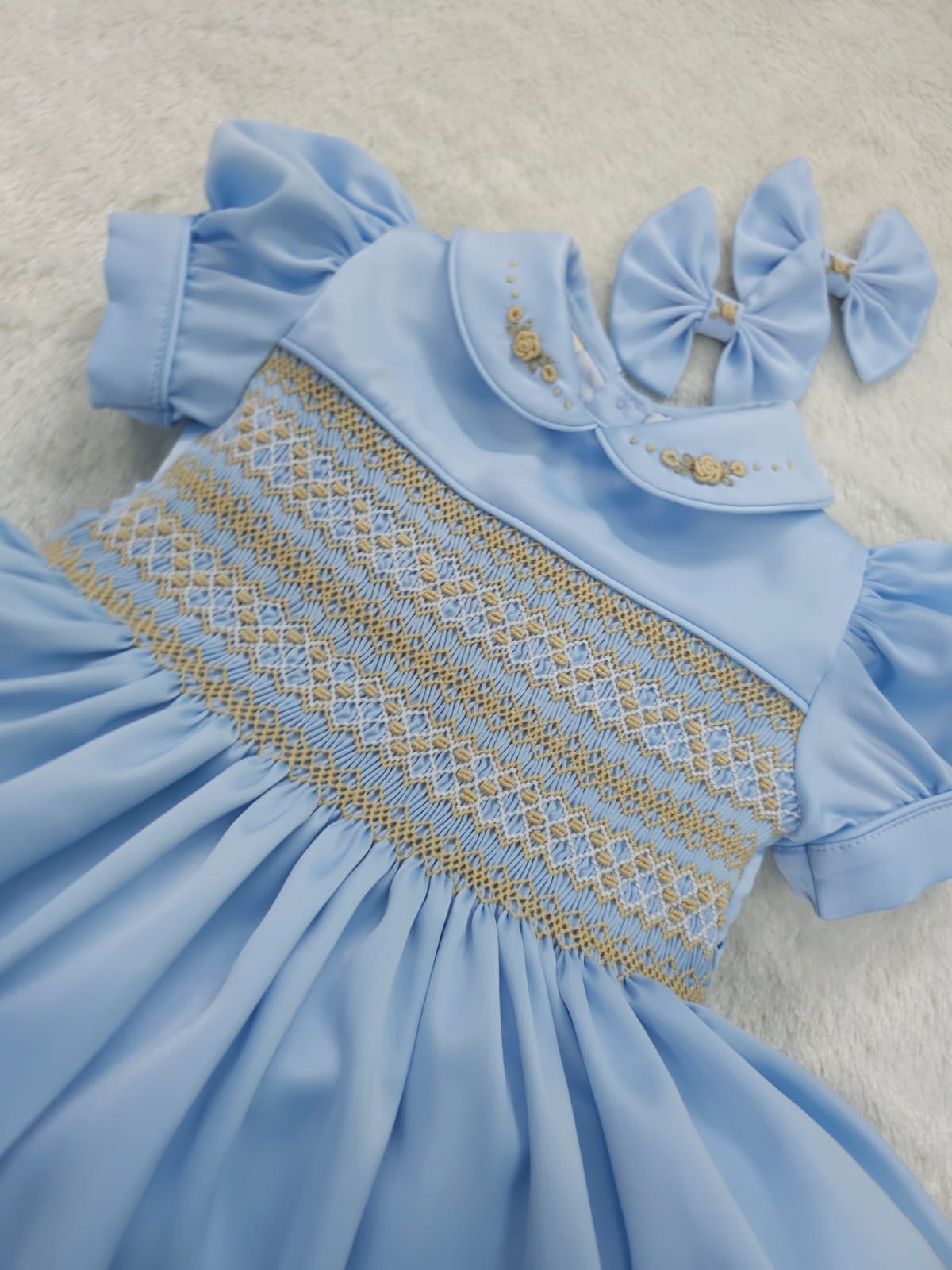 Baby blue satin with gold smocking