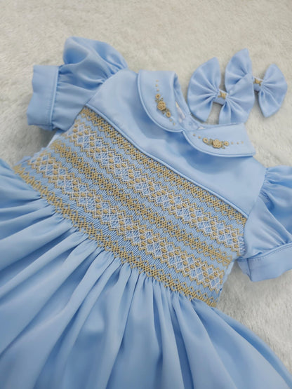 Baby blue satin with gold smocking