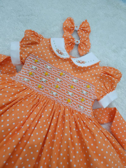 Orange polkadot smocked dress