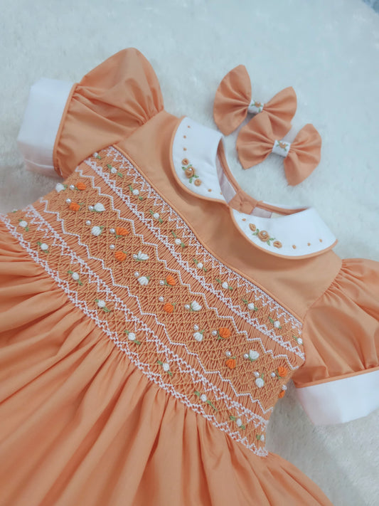 Orange/Coral smocked dress with pearls
