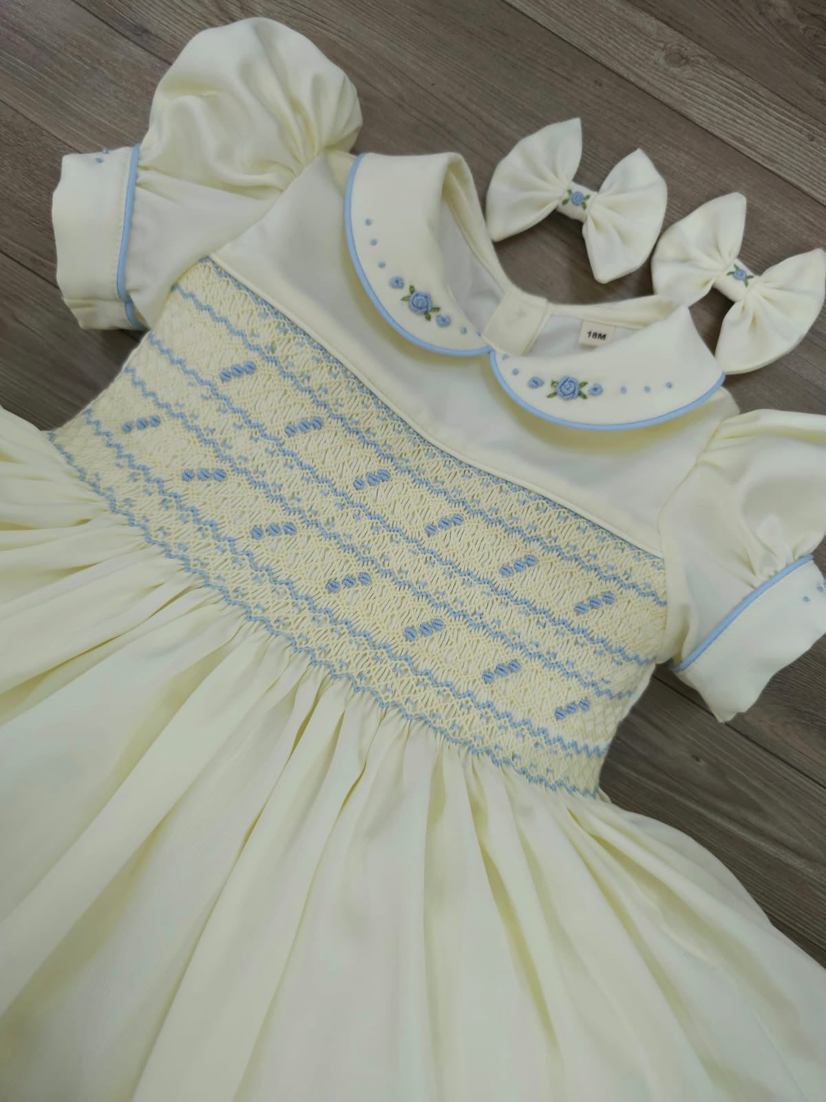 Satin cream with baby blue smocking