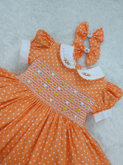 Orange polkadot smocked dress