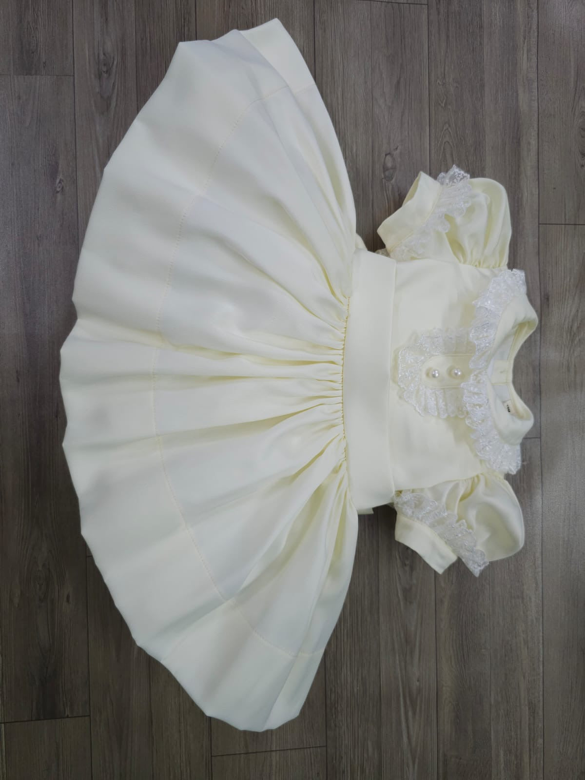 Cream classic dress with lace collar and sleeves and pearl buttons