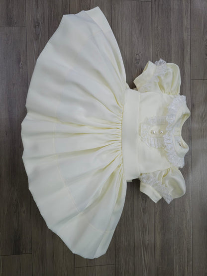 Cream classic dress with lace collar and sleeves and pearl buttons