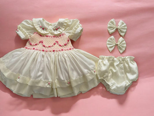 Cream with pink smocking and pink garland