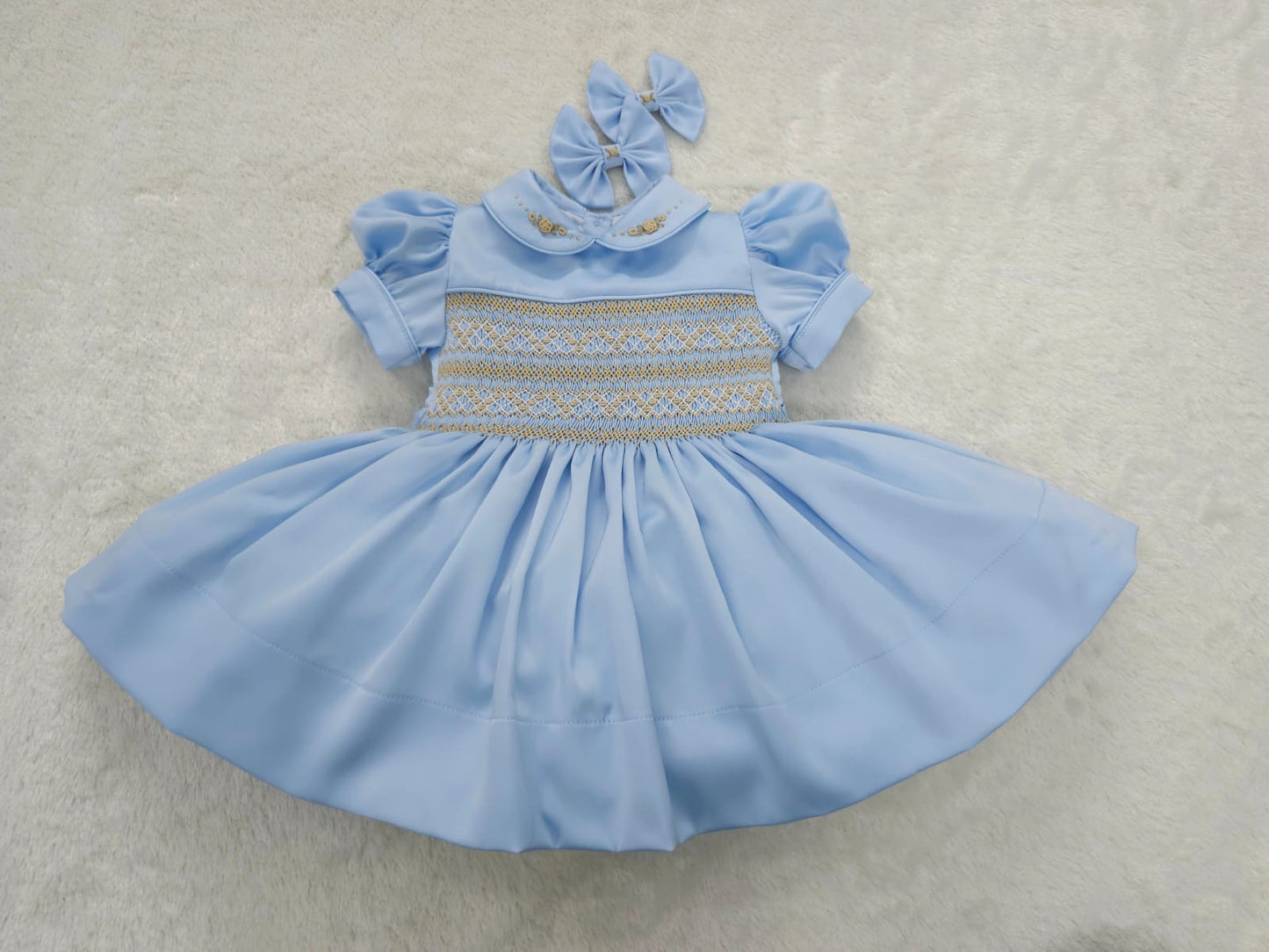 Baby blue satin with gold smocking