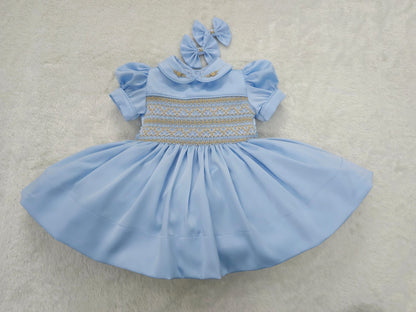 Baby blue satin with gold smocking