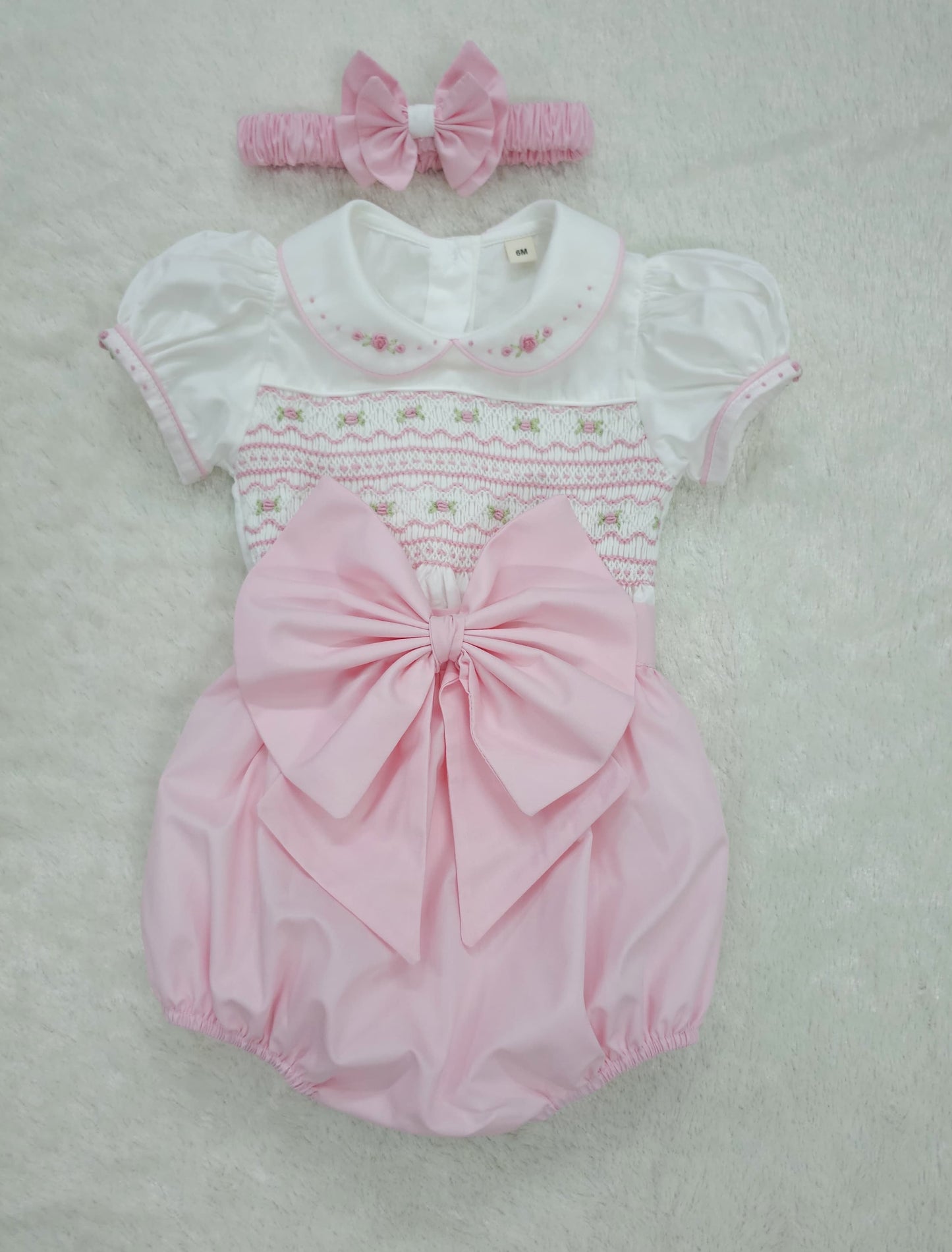 Baby pink hand smocked girls romper