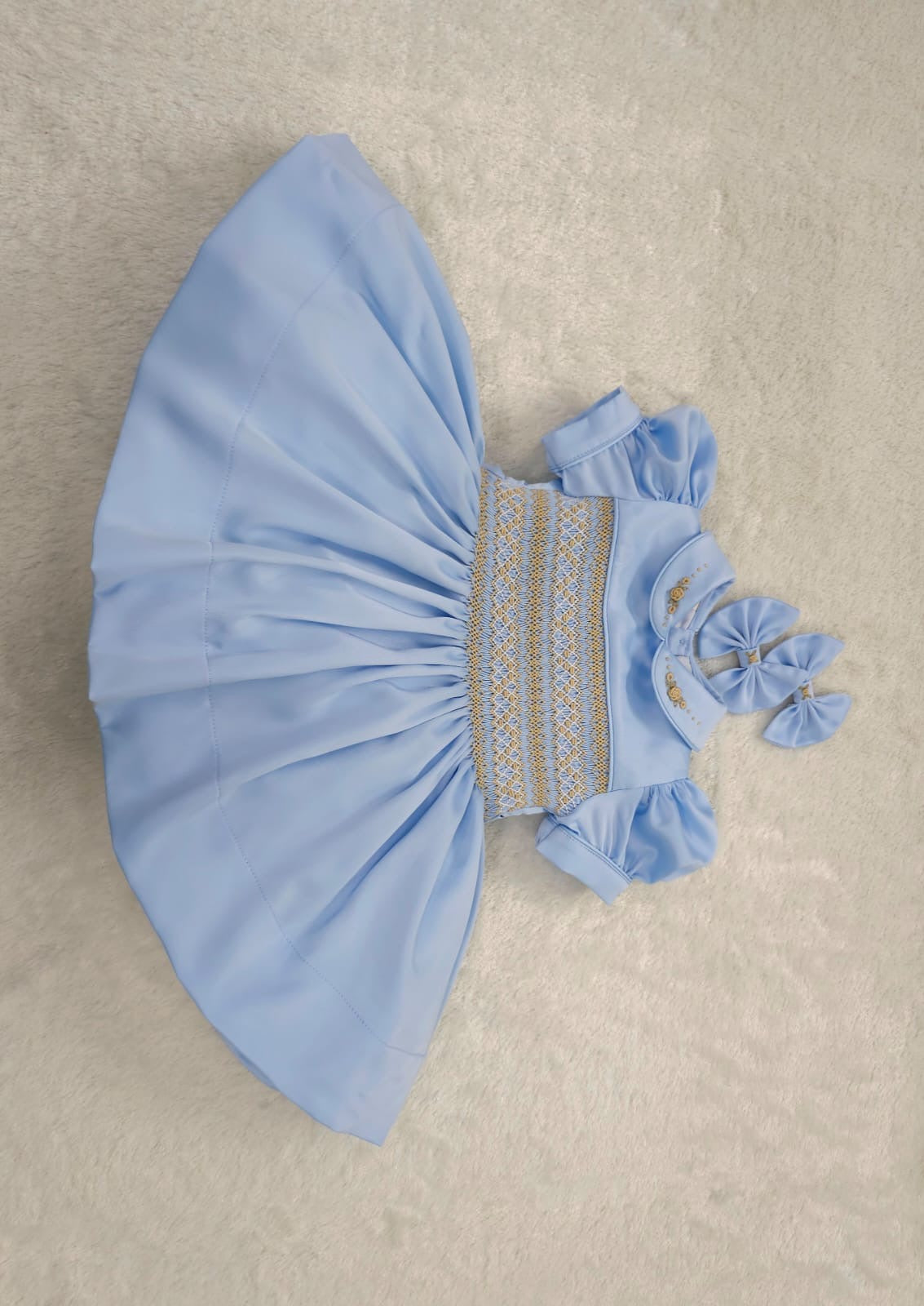 Baby blue satin with gold smocking