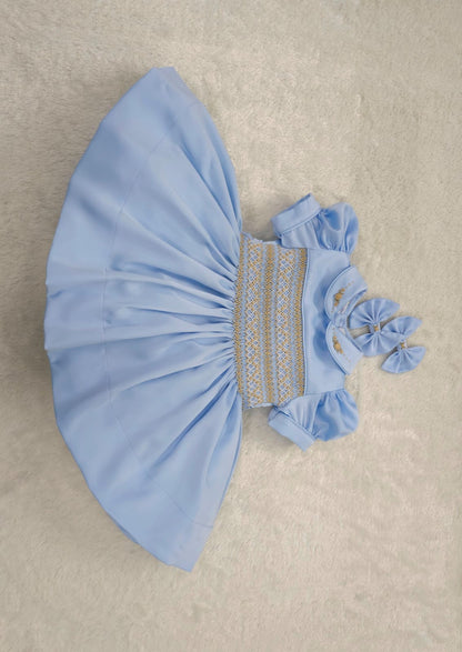 Baby blue satin with gold smocking