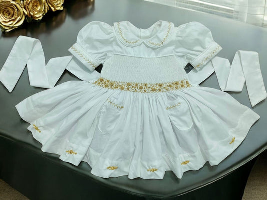 White and gold smocked dress