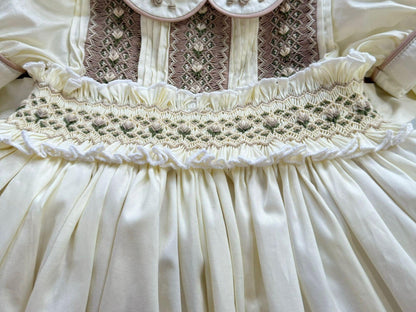 Cream dress with smocking on chest and waistband