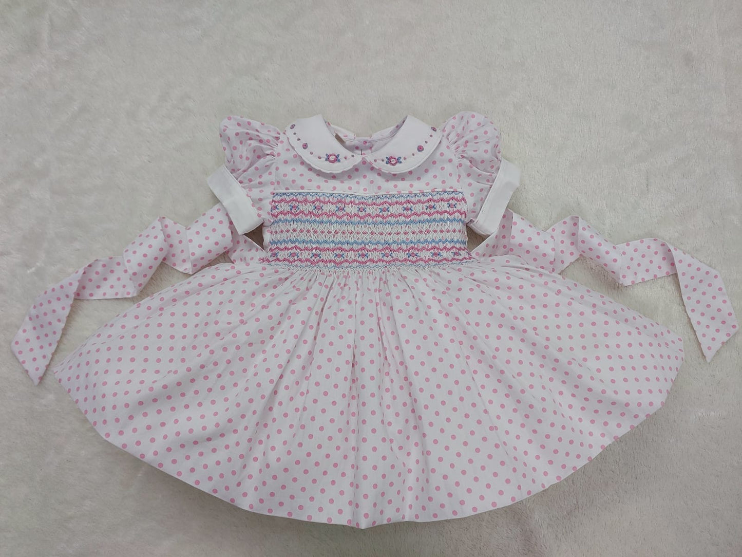 Pink and white polkadot smocked dress