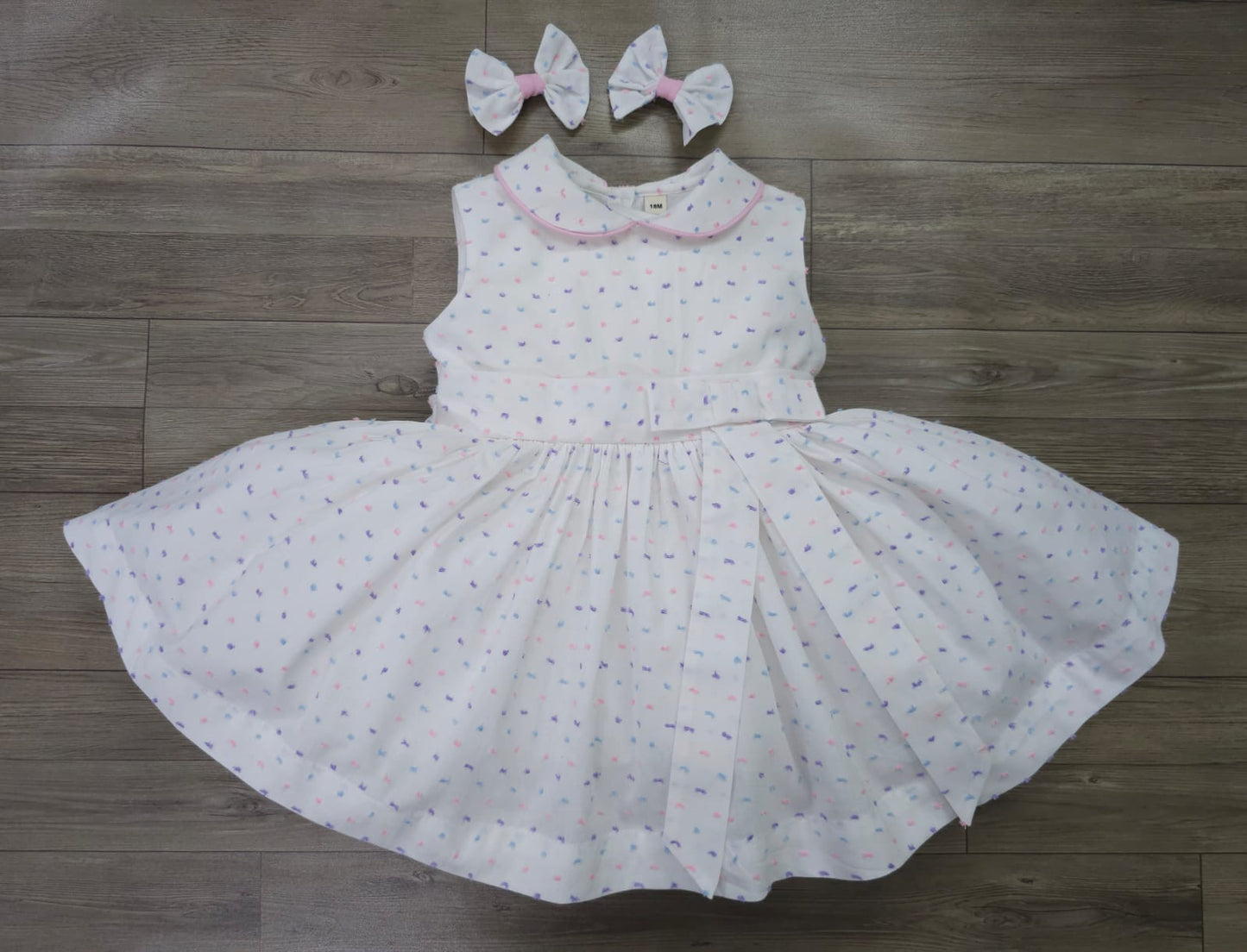 Sleeveless classic Swiss dot dress