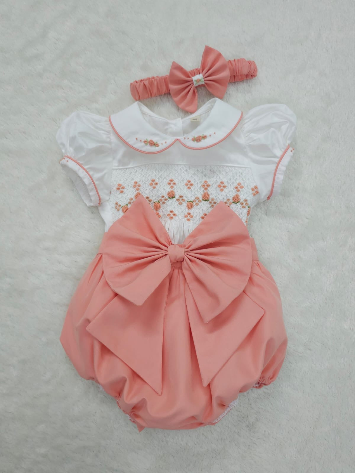 Coral peach smocked romper comes with hair bows or headband for baby sizes