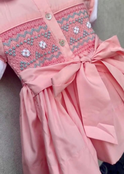 Peach coral smocked back and front with blue and white smocking