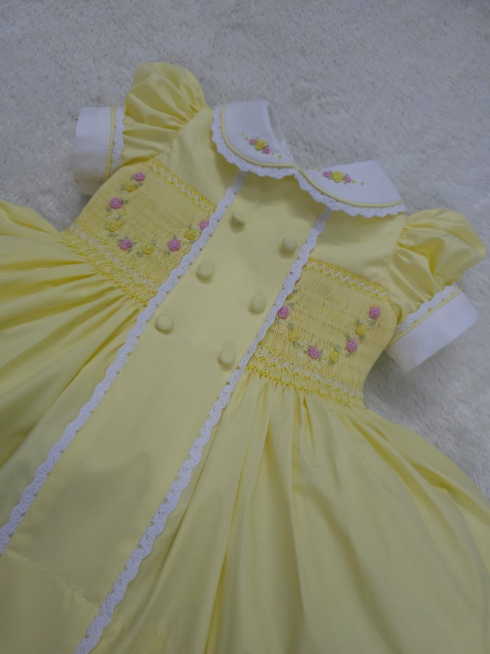 Lemon smocked garland dress with buttons on front