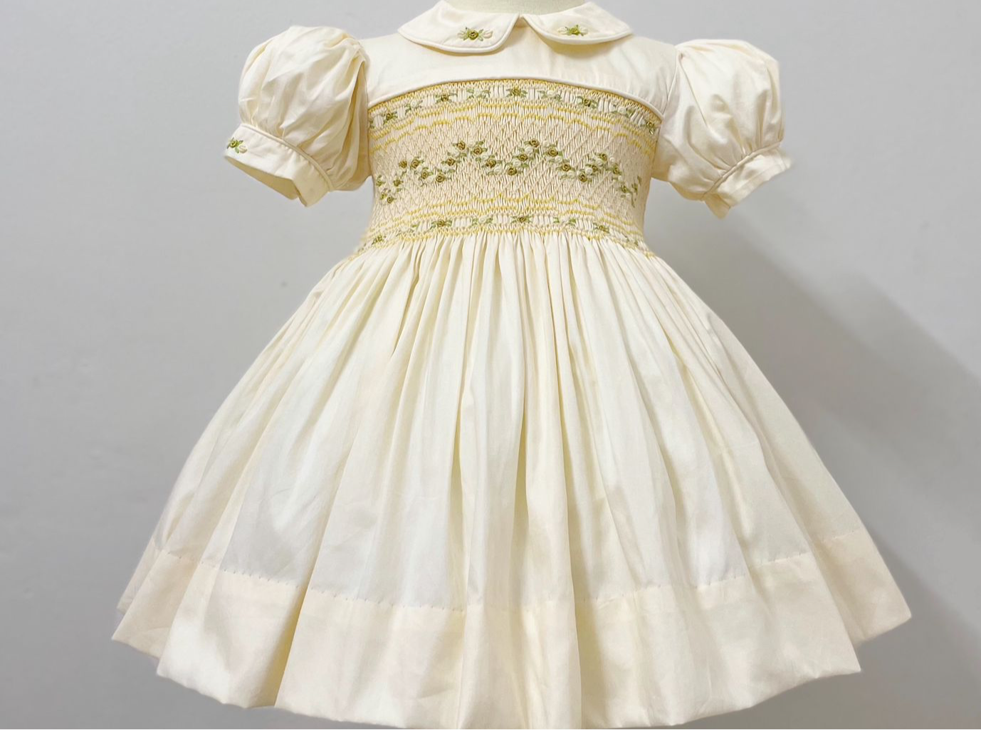 Cream and gold smocked back and front
