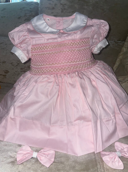 Pink with gold. Smocked back and front