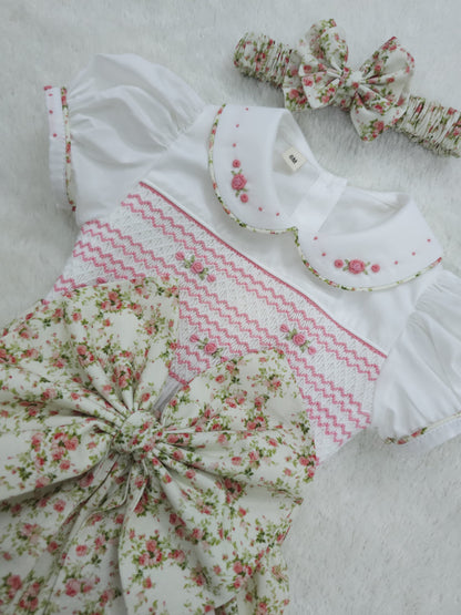 Pink floral hand smocked girls romper