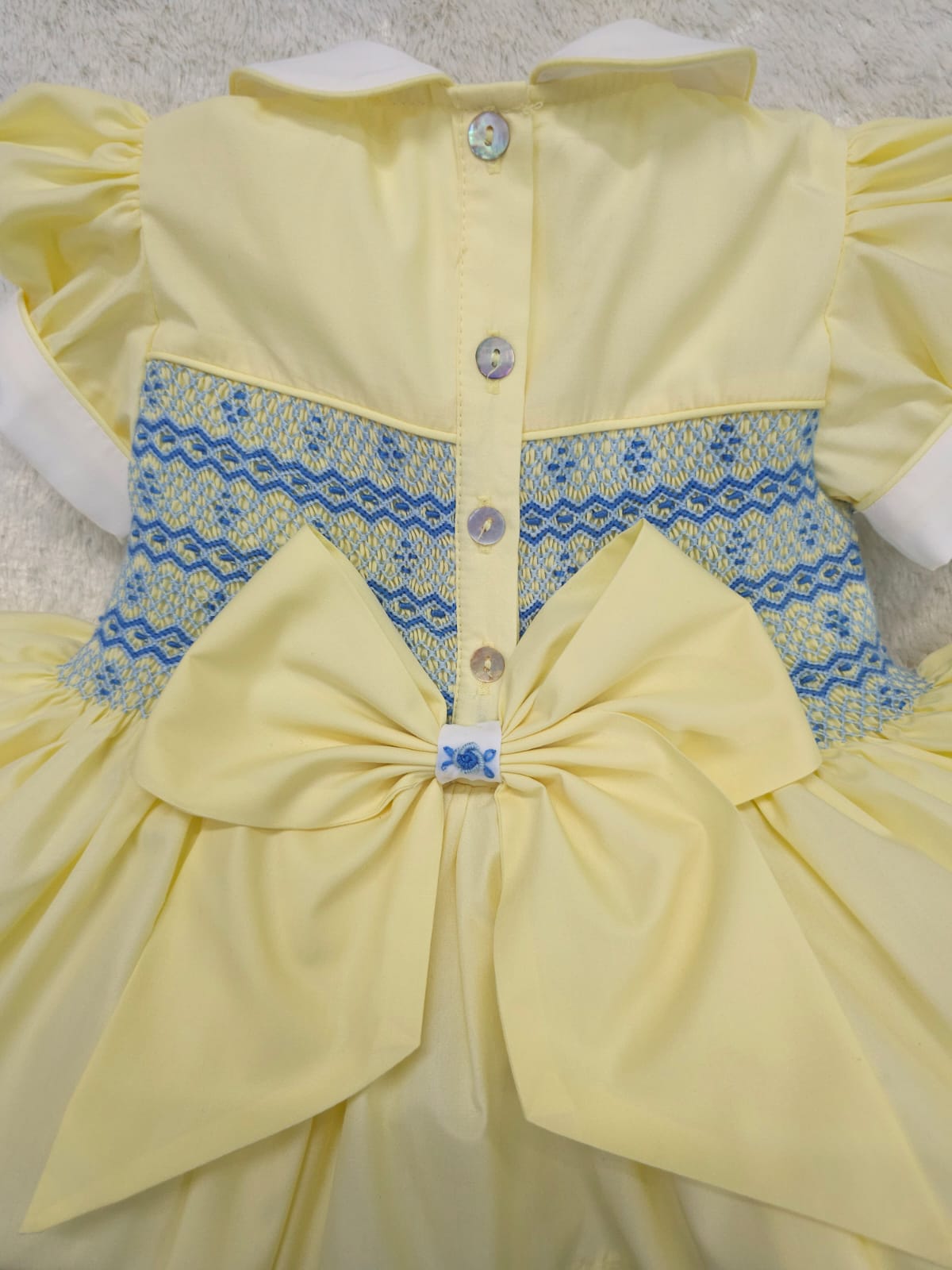 Lemon with blue smocked back and front with fixed bow. ( have matching boys suit available )