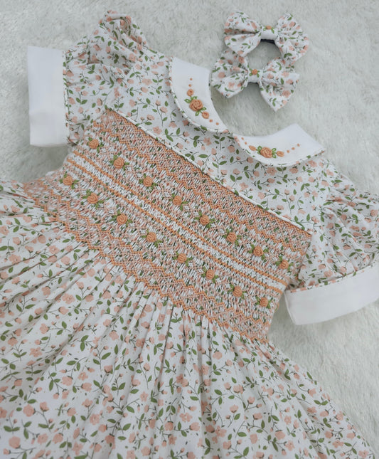 Floral smocked dress with peach embroidered flowers