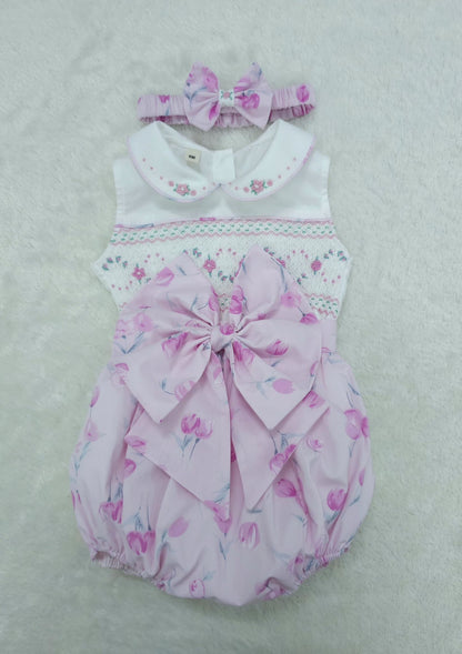 Pink floral sleeveless smocked romper
