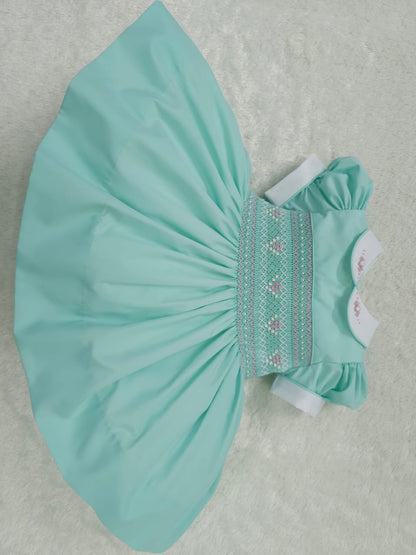 Mint with pink smocking and pearls