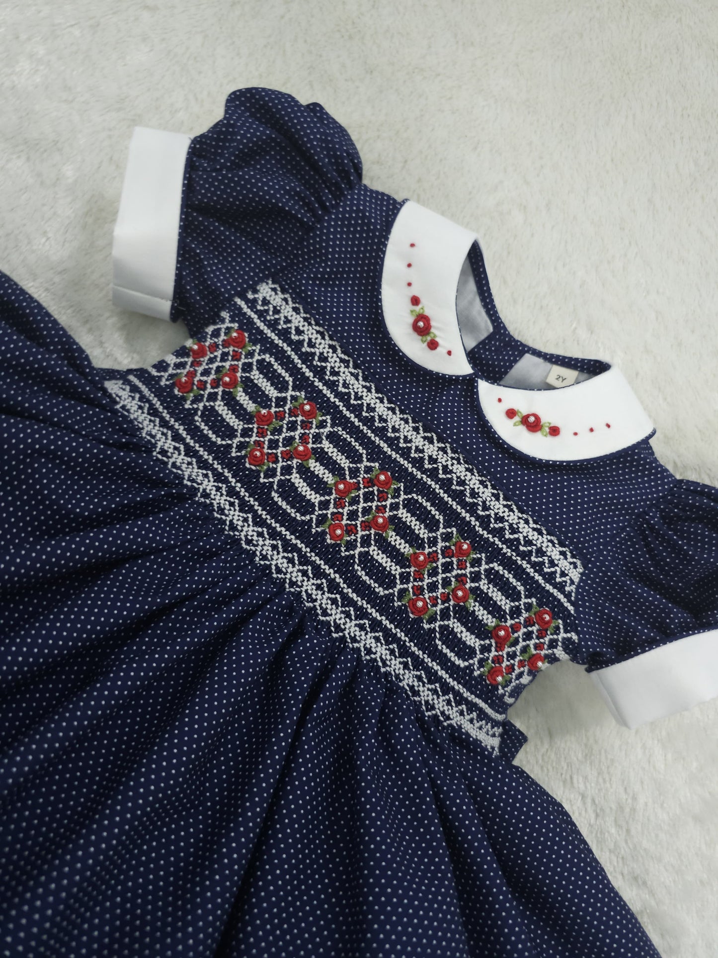 Navy polkadot with red and white smocking ( got matching boys suit available and matching girls romper  )
