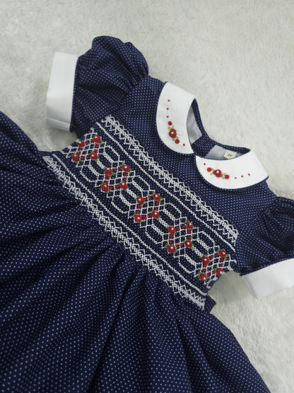 Navy polkadot with red and white smocking ( got matching boys suit available and matching girls romper  )