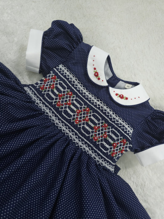 Navy polkadot with red and white smocking ( got matching boys suit available and matching girls romper  )