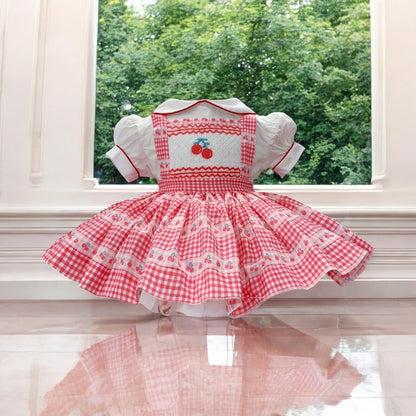 Cherry smocked pinafore dress