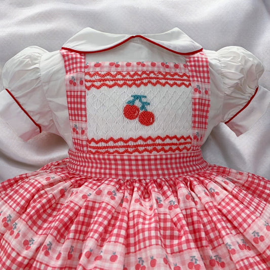 Cherry smocked pinafore dress