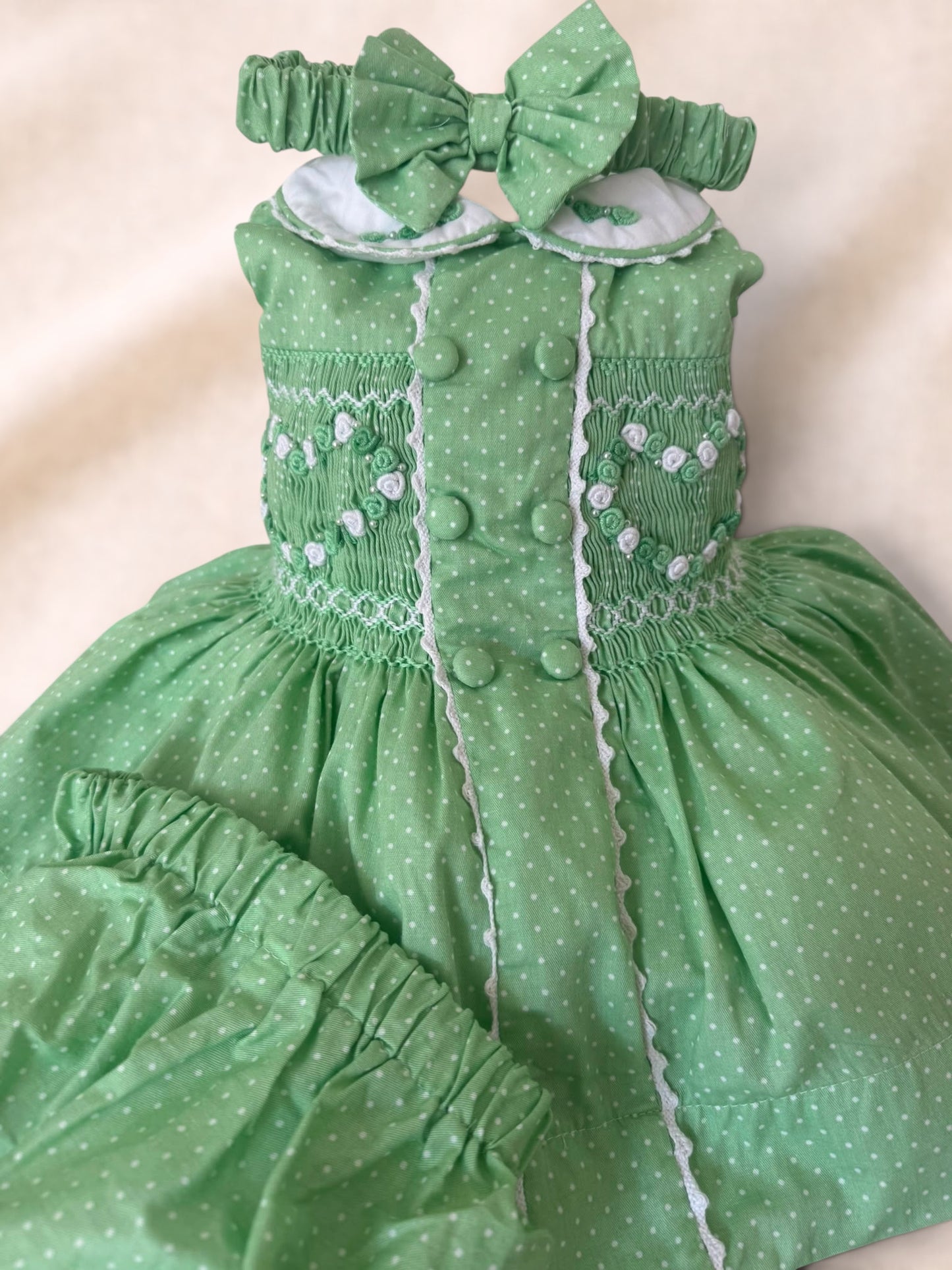 Green polkadot sleeveless smocked dress ( have matching boys suit available)