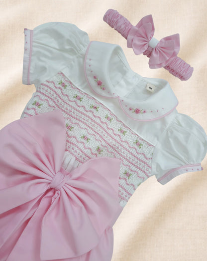 Baby pink hand smocked girls romper