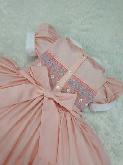 Peach smocked back and front with blue and white smocking