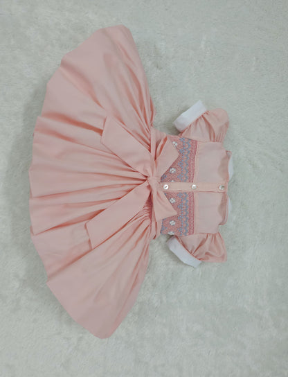 Peach smocked back and front with blue and white smocking