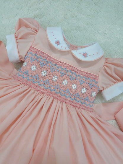 Peach smocked back and front with blue and white smocking