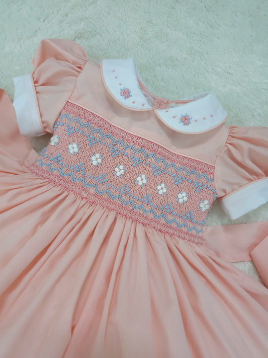 Peach smocked back and front with blue and white smocking