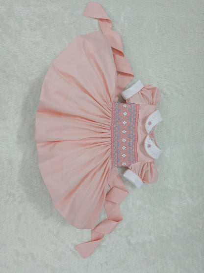Peach smocked back and front with blue and white smocking